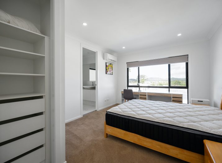 Plain mattress in bedroom.