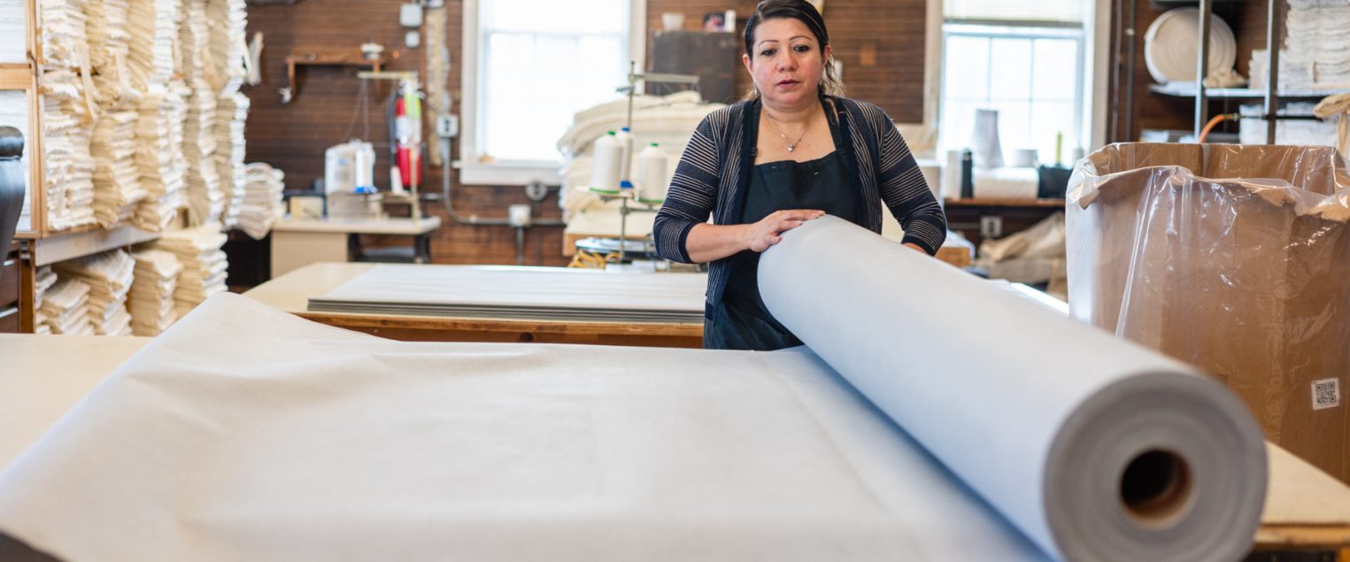 Gardner Mattress employee hand crafting a mattress in Salem, Massachusetts.