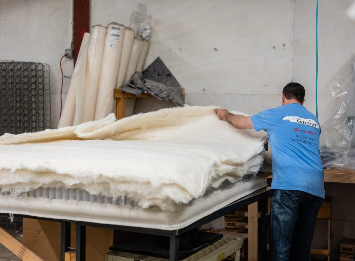 Gardner Mattress employee hand crafting a mattress in Salem, Massachusetts.