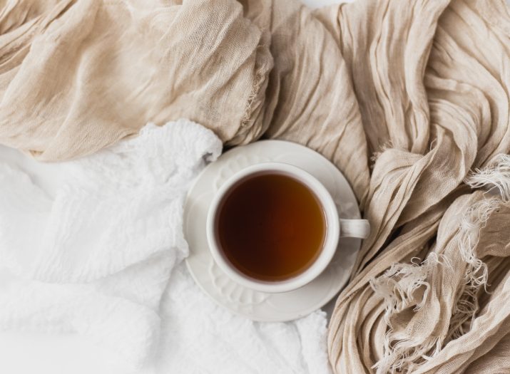 Cup of coffee on top of cloth sheets
